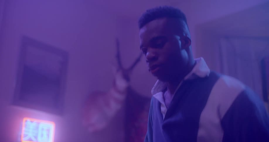 Black boy dances at home party