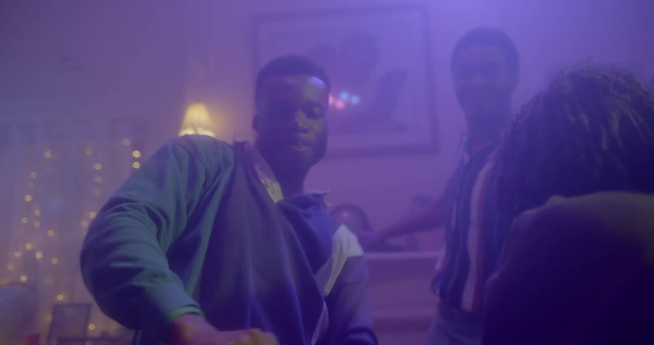 A group of teens dance together