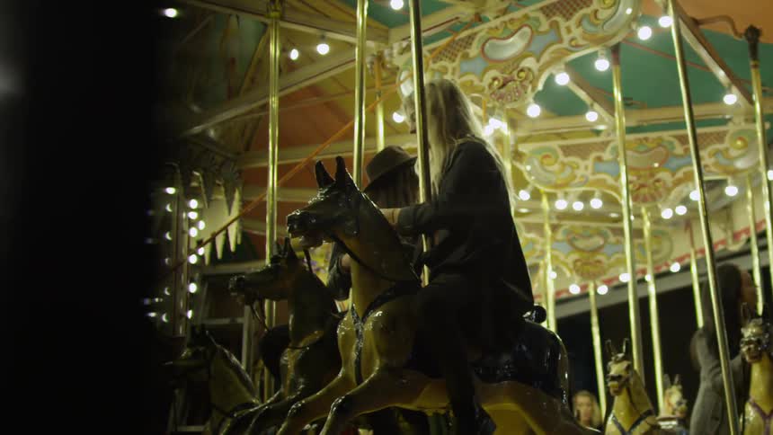 Girlfriends Riding Carousel