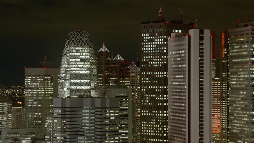 Lit up skyscrapers in a downtown area