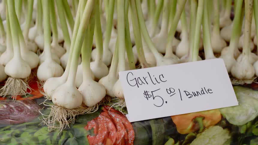 Garlic bundles on display at a market