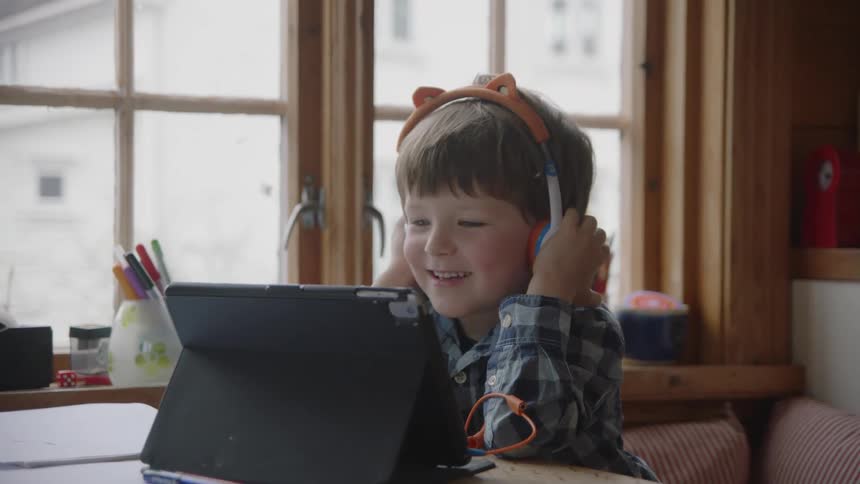 A child watches a tablet