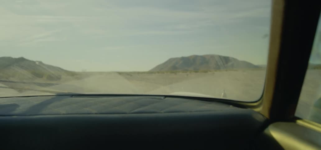 Interior shot of cruising down a dirt road in the country