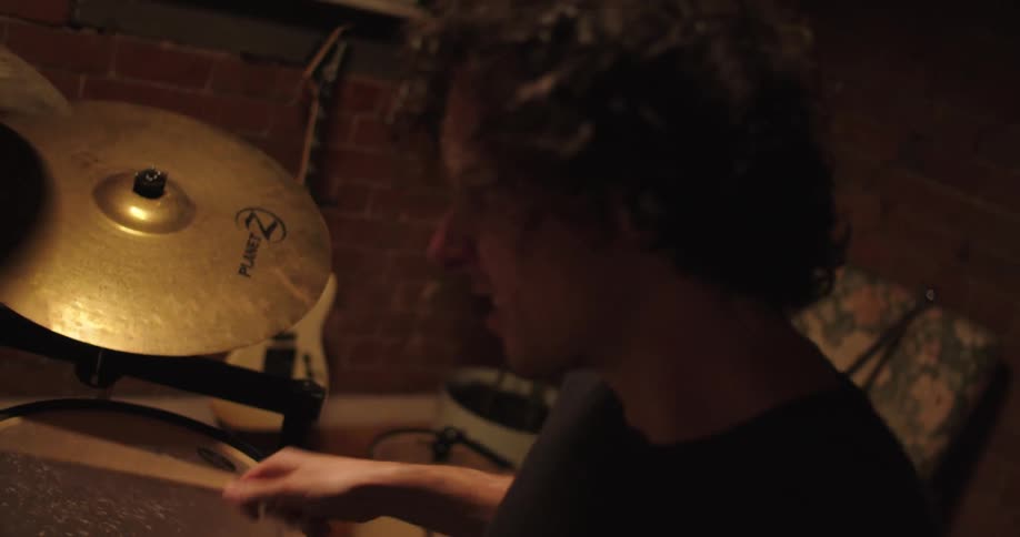 A man plays the drums