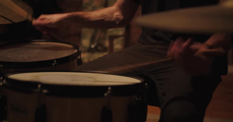 A man is playing the drums