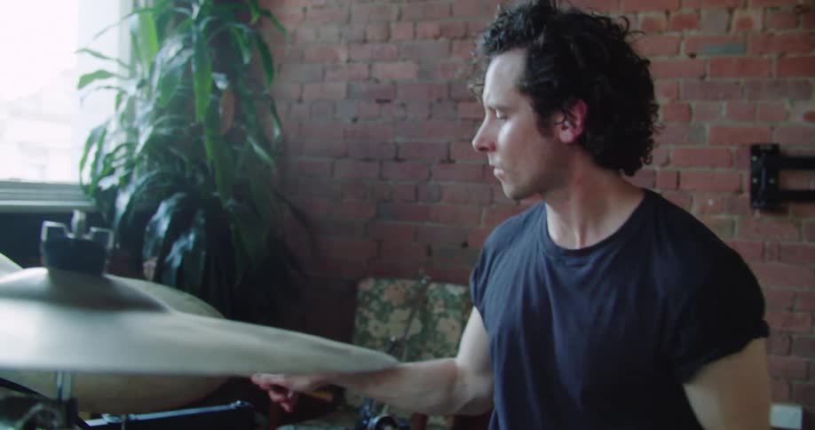 A man plays on drums