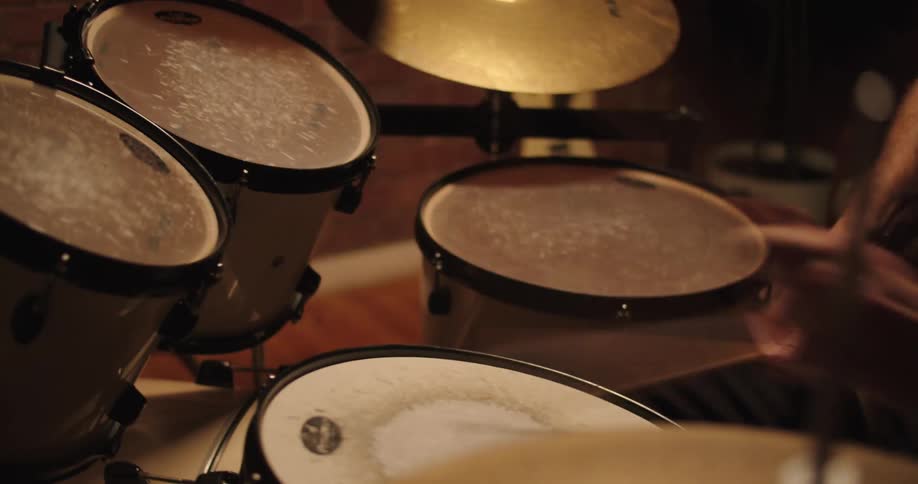A man plays the drums