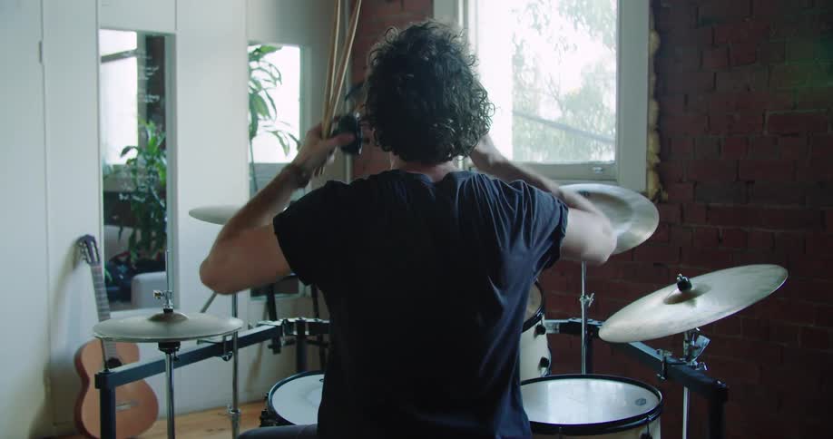 A man gets ready to play drums