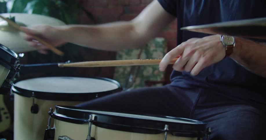 A man plays the drums