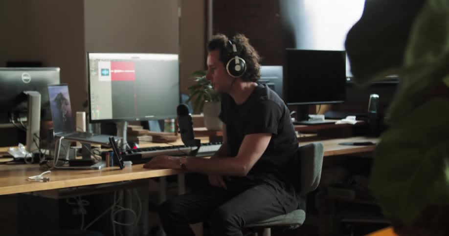 A man talks over a headset