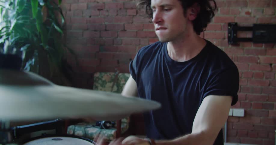 A man practices the drums
