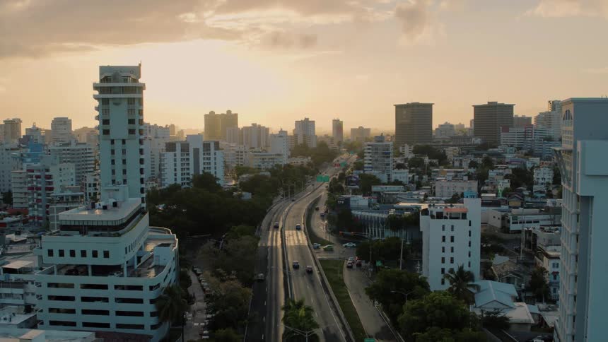 A city with roads vehicles and buildings