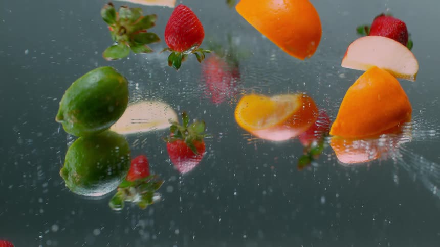 Fruit that is landing in water on a rainy day