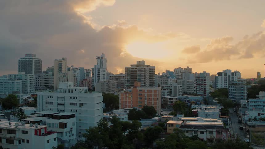 Flying over a city at dusk