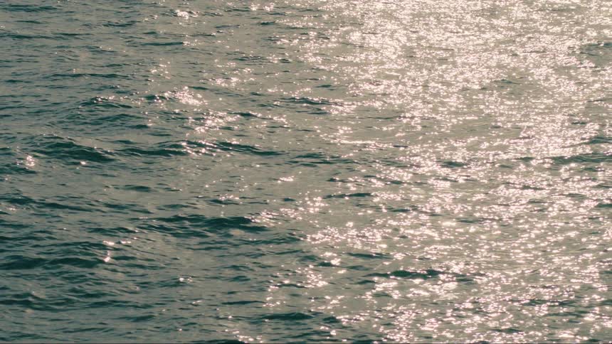 Sun light reflecting on small waves in ocean