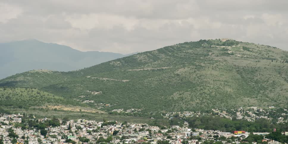 A town with a hill in the background