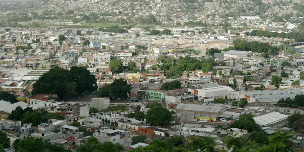 A town with buildings roads and trees