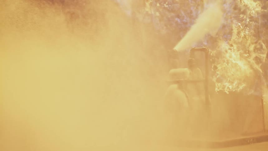 Fire and smoke surround metal pipes