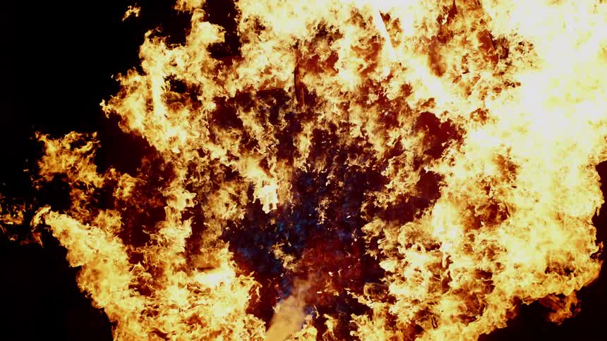 Slow motion raging flames burning into the air