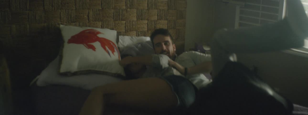 Man follows woman into her bedroom and playfully tackles her to the bed