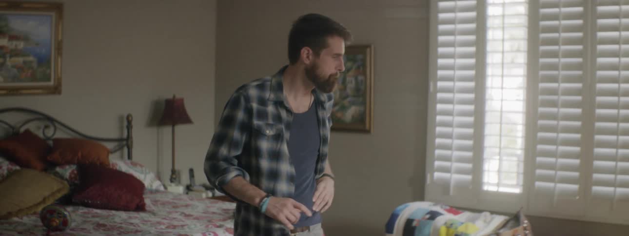 The man rushed back and forth in the bedroom