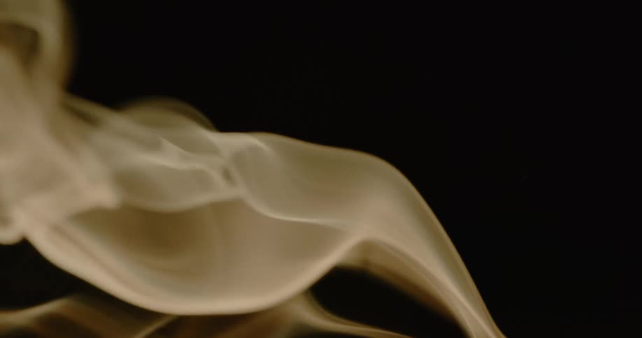 Smoke moves on a dark background