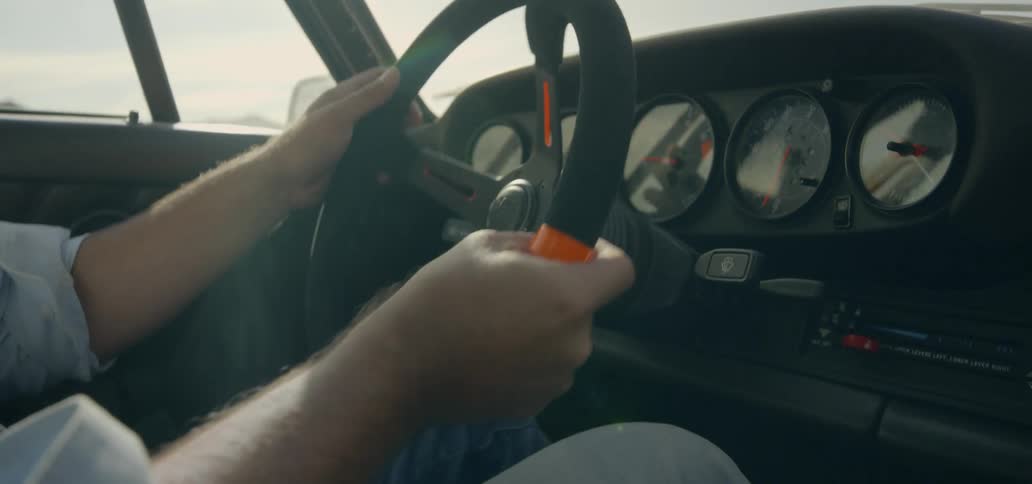 Man turns the steering wheel of his vehicle