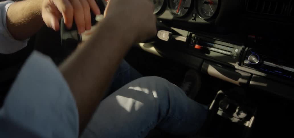 Man drives sport car on a desert