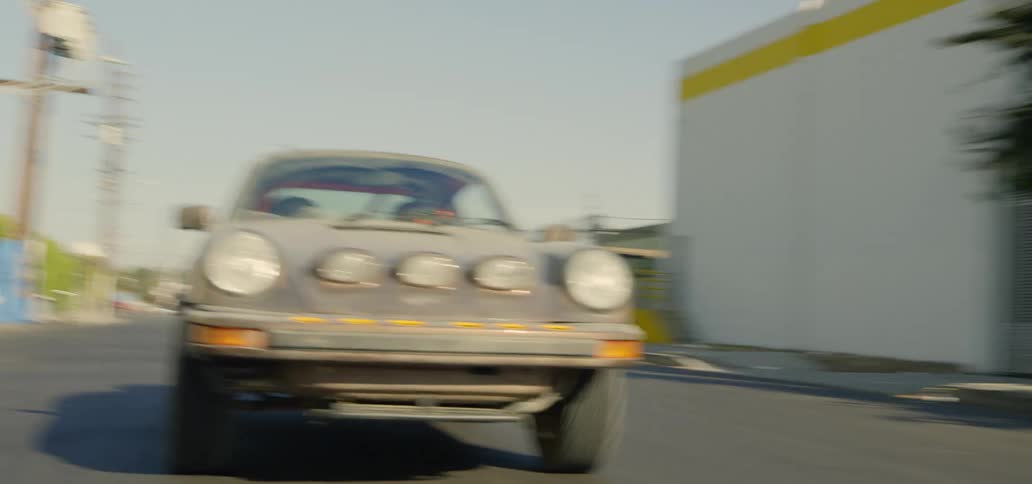 A car races down the city street