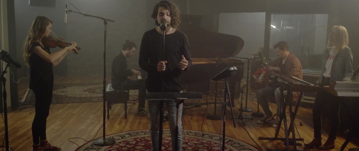 A band in a recording studio recording a song