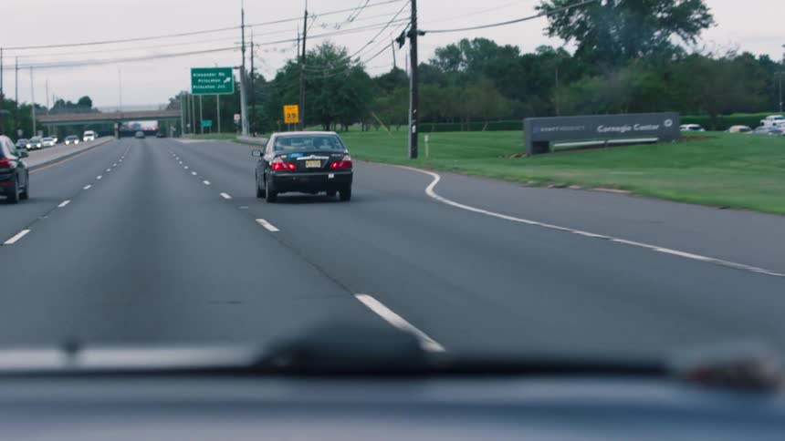 A car drives down the road