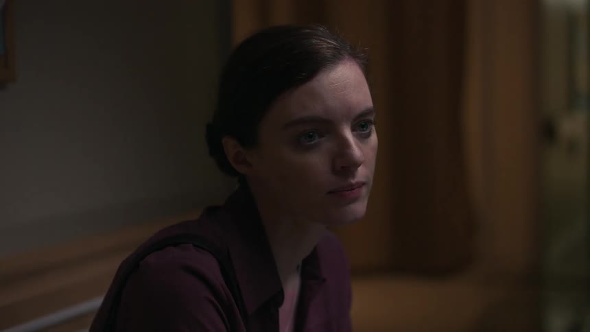 A woman sadly stares