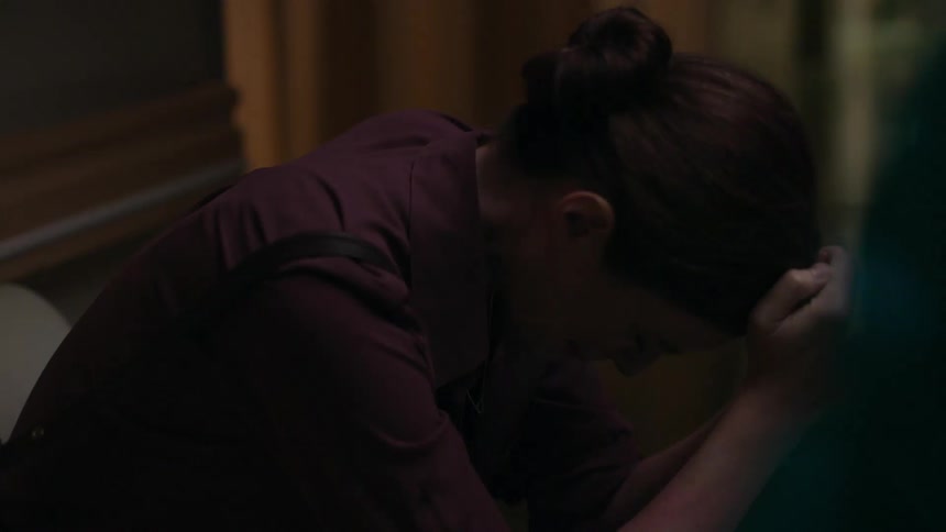 Black woman consoles depressed white woman sitting on the couch