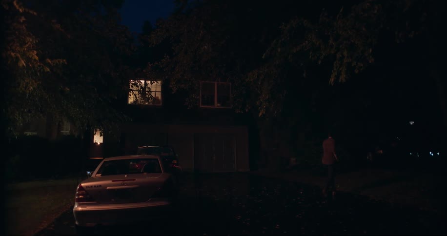 A person walks at night