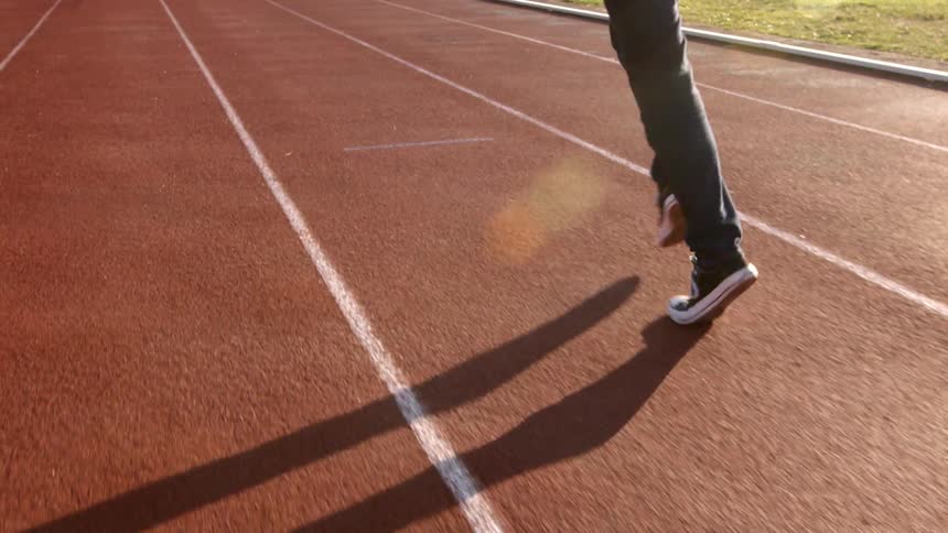 A man jogging down a track
