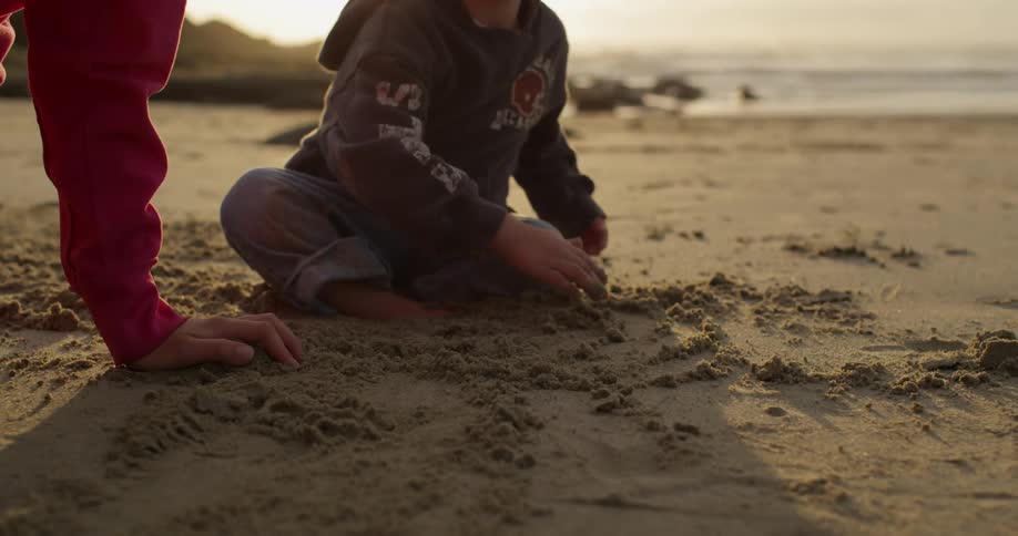Two children playing on the beach