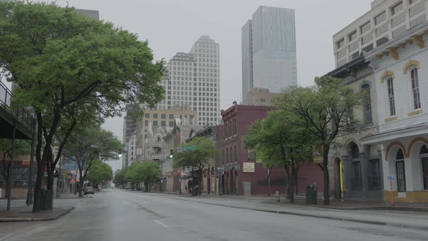 An empty rain covered street outside of downtown