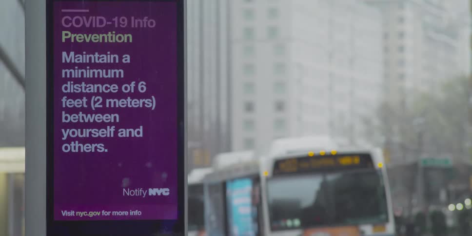 A small billboard screen flashed medical information by a city street