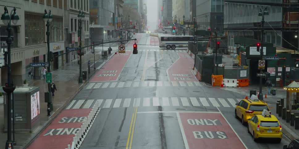 People walk across the street in the city