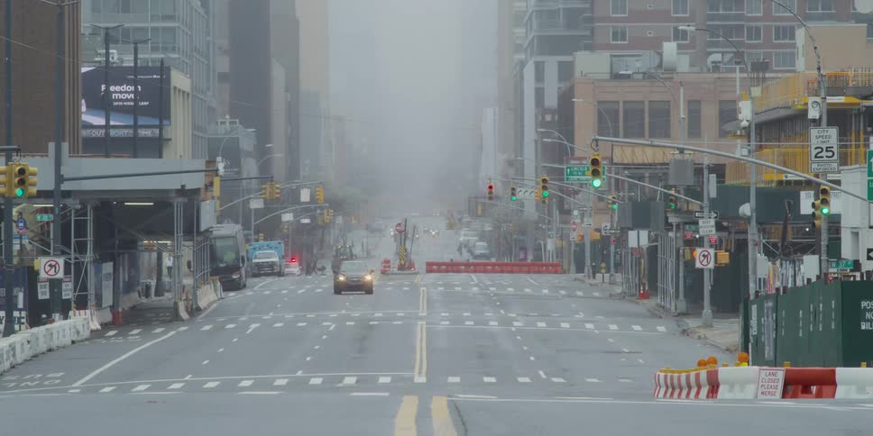 A city street with cars and buildings in the background