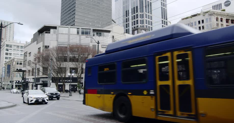 A bus drives down a city street