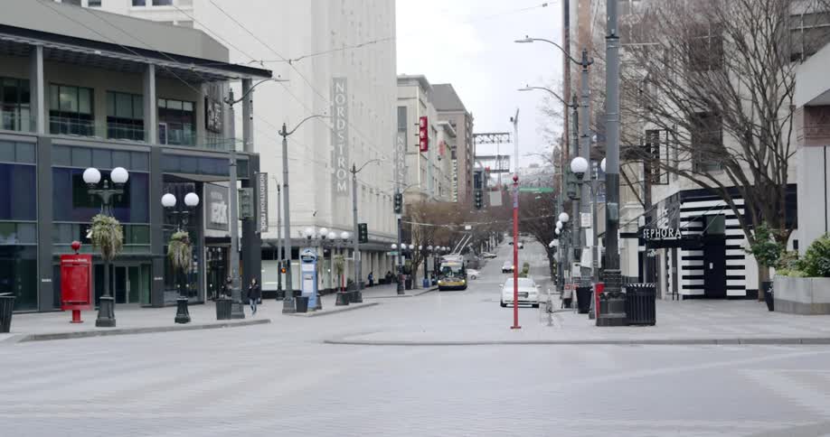 Pedestrians walk through a downtown area