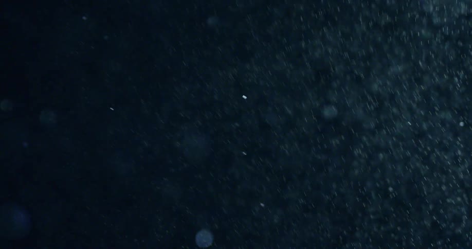Snow falls at night