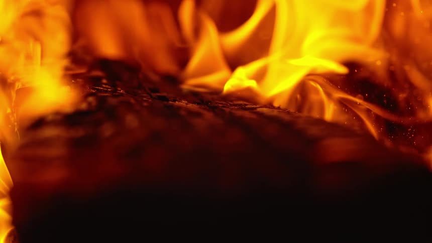 Flames ignite over the wood