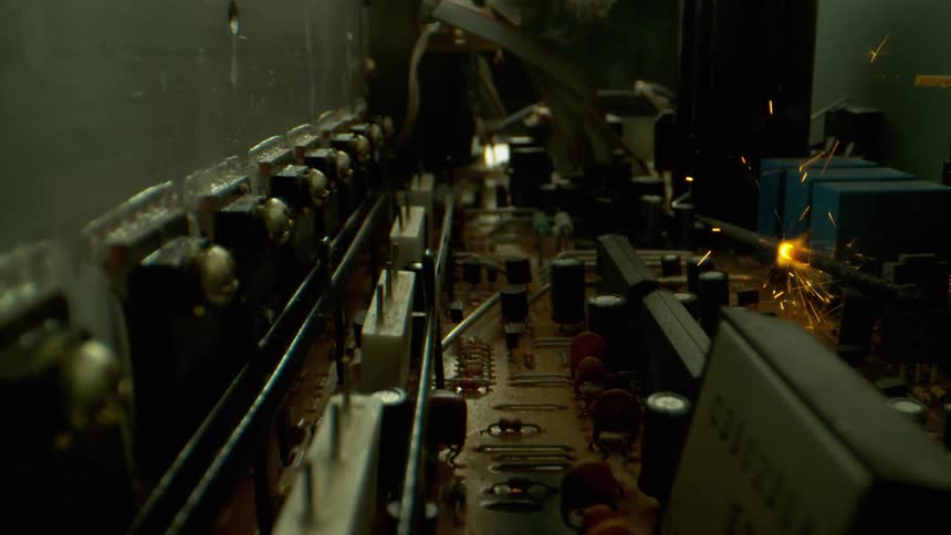 A sparking and burning component on a circuit board