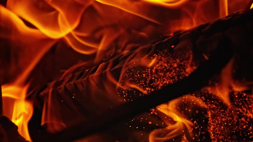 Slow motion fire burning a wood log