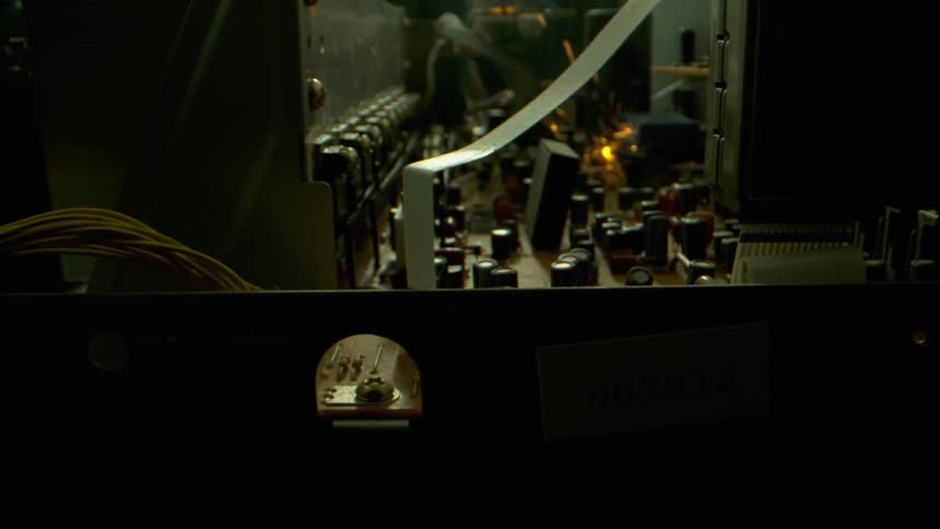 Sparks fly inside some machinery