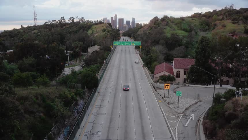 Light traffic moves down a five lane highway