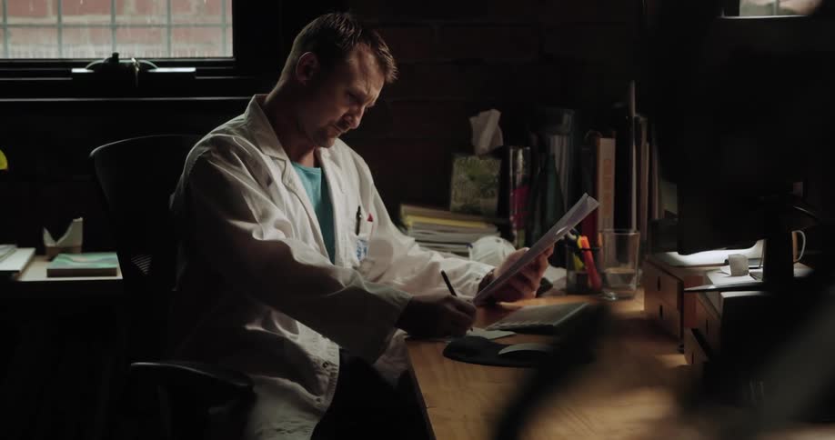 A man writes down on a pad