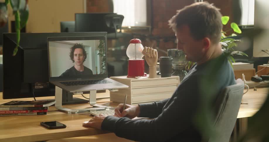 Two people having a video call through a computer